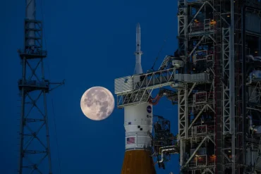 Orion atop SLS, with the target destination glowing in the background.